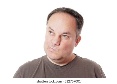 skeptical middle aged man making a face and twisting his mouth - Powered by Shutterstock