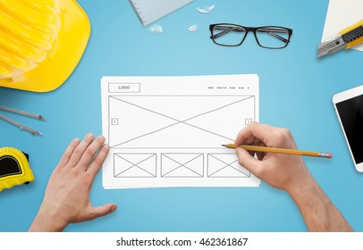 Sketching new website design. Modern flat design on paper.