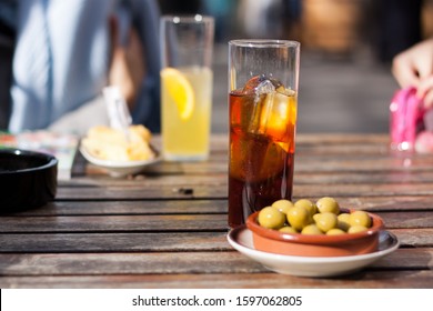 
Skewer Of Olives With A Vermouth