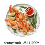 Skewers with delicious grilled shrimps, lime and sauce isolated on white, top view