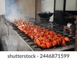 Skewers of shish kebab and chicken cooked on a grill near Ampel area in Surabaya, Indonesia. Street Food Photography.