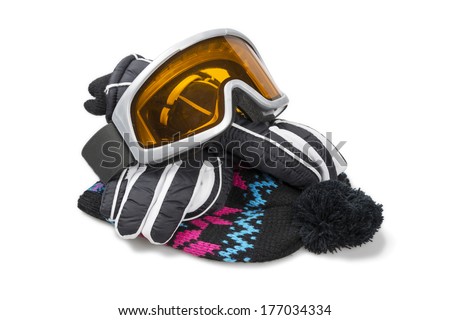 Ski gloves, cap and goggles isolated over white with clipping path.