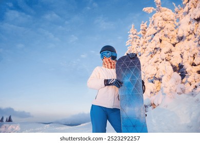 Ski Goggles Of Snowboarder With The Reflection Of Snowed Mountains. Winter Sports. Portrait Of Woman On The Background Of Mountains and Sunset.   Holding a Snowboard And Wearing Ski Glasses.  - Powered by Shutterstock