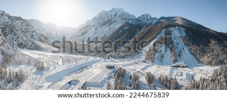 Ski Jump in Planica near Kranjska Gora Slovenia covered in snow at winter time. Aerial Panorama