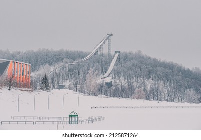 Ski Jumping Slopes Or Towers In Tatarstan, Russia. Ramps Surrounded By Snow-covered Trees On A Hill . Ski Jumping Ramp