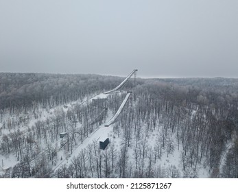 Ski Jumping Slopes Or Towers In Tatarstan, Russia. Ramps Surrounded By Snow-covered Trees On A Hill . Ski Jumping Ramp