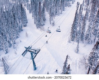 Ski Lifts Winter Mountains With Snowy Forest, Aerial Top View.