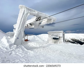 Ski Resort Chair Lift Station In High Top Mountains. Snow Weather, Frost, Ice. Incredible Winter Landscape. Travel, Sport, Recreation