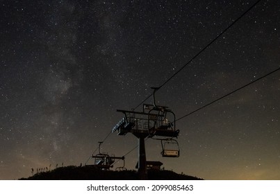 Ski Resort Chairlifts Illuminated By Starry Night