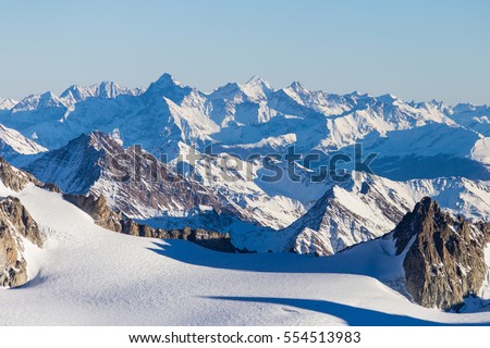Ski resort  Chamonix Mont Blanc. The mountain is the highest in the Alps and the European Union. Alpine mountains range landscape in beauty French, Italian and Swiss ALPS seen from Aiguille du Midi
