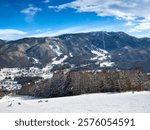 Ski resorts seen from other one on the opposite side of valley (Yamanouchi, Nagano, Japan)