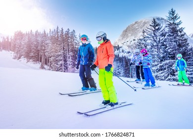 Ski School For Kids, Group Of Children Stand On The Slope Together Before Going Down