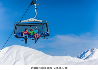 Ski, Skiing - Family Skiers On Ski Lift