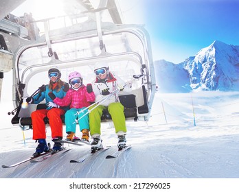 Ski, skiing - skiers on ski lift - Shutterstock ID 217296025