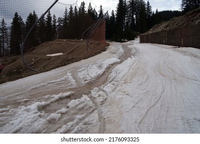 Ski slope in Pamporovo, a ski resort in Bulgaria, in the spring with melting snow.