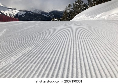 Ski Slope Prepared For Skiing With A Snowcat. Velvet Shape Of Groomed Slope. Best Slope For Skiing And Snowboarding