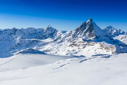 Ski Slope And Snow Covered Winter Mountains. Matterhorn Is A Mountain In The Pennine Alps On The Border Between Switzerland And Italy