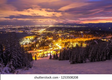 Ski Slopes And Mountain Town At Night	
