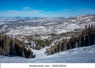 The Ski Slopes Of Steamboat Springs, On Mount Werner Of The Rocky Mountains Of Colorado, Lined By Pine And Aspen Trees. 