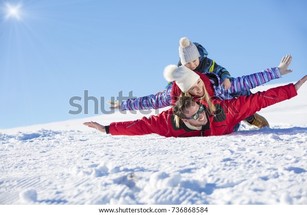 Ski, snow\
sun and fun - happy family on ski\
holiday