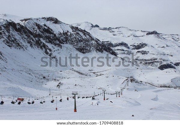 Chile´s ski station resort with white snow, montains\
background and cable\
car