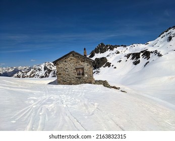 Ski tour on the Wiss Platte mountain above Sankt Antonien in Graubunden, Switzerland. Ski mountaineering in winter. 
