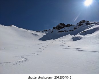 ski touring track. Freeride in powder snow above Elm. Big mountains in Switzerland. Ski touring mountaineering. Sun fun
