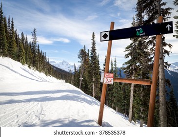 Ski Trail Sign Pointing To A Black Diamond Run. 