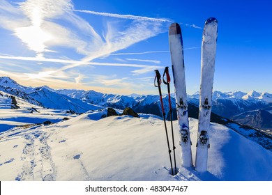 Ski in winter season, mountains and ski touring equipments on the top at sunrise. - Shutterstock ID 483047467