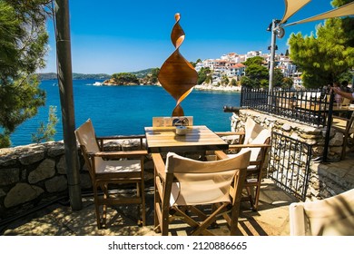 Skiathos, Greece- Avg 10, 2019. Beautiful view from table on cafe  in Skiathos Town, Greece. Europe.