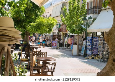 Skiathos, Greece- Avg 10, 2019. Street with  traditional shops and cafe  in Skiathos Town, Greece. Europe.