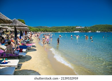 Skiathos, Greece- Avg 10, 2019. People are on vacation at  Koukounaries beach,  Skiathos Island , Greece.