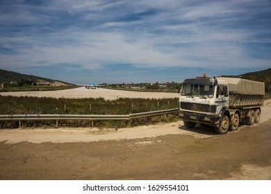 Skiathos, Greece - May 09, 2014, People Watching Airplane Preparing To Take Off On The Island Of Skiathos In Greece