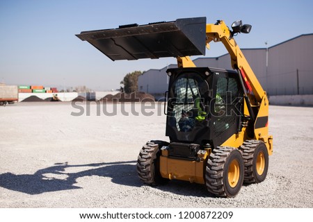 Skid loader or bobcat standing up position