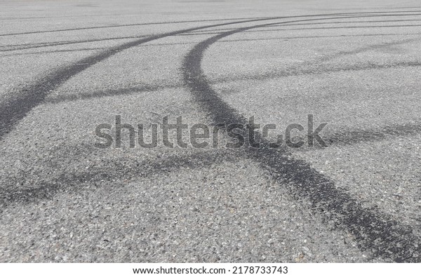 Skid marks on the asphalt of the road made by a\
racing car