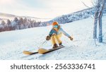 Skier in bright gear gliding down snowy slope, surrounded by snow-covered trees and distant landscape under soft sunlight. Concept of extreme sports, winter sports, tourism, recreation. Ad