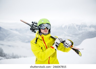 Skier Carrying Skis