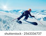 Skier carving down snowy mountain, creating spray with ski poles extended, bright sunlight and vast snowy peaks in background. Concept of extreme sports, winter sports, tourism, recreation. Ad