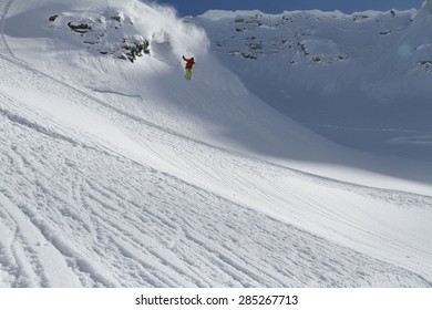 Skier in deep powder, extreme winter freeride