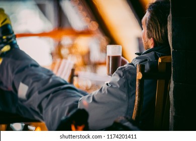 A Skier Drinking Cocoa In A Ski Lodge