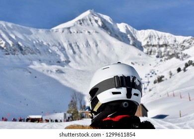 Skier Gazing Out At Lone Mountain At Big Sky Ski Resort In Montana