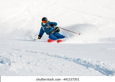 Skier making a turn in powder