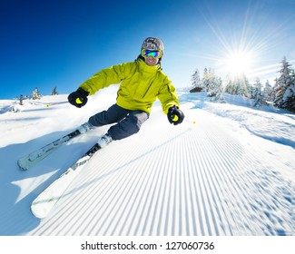 Skier On Piste In High Mountains