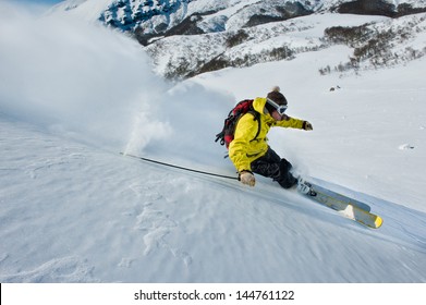 Skier Skidding In The Snow, Off Piste.