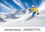 Skier skiing down a freshly groomed slope , beautiful panorama of high mountains during sunny day