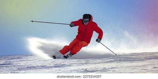 Skier skiing downhill in high mountains against sunshine - Shutterstock ID 2275314337