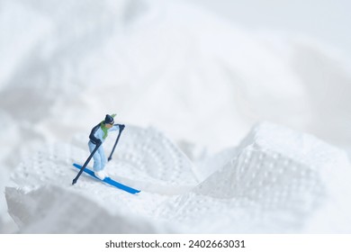 Skiers in action, white snow landscape, miniature figures scene, winter sports - Powered by Shutterstock