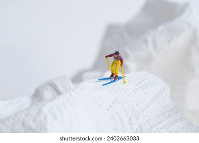 Skiers in action, white snow landscape, miniature figures scene, winter sports - Powered by Shutterstock