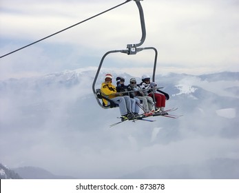 Skiers On Chair Lift