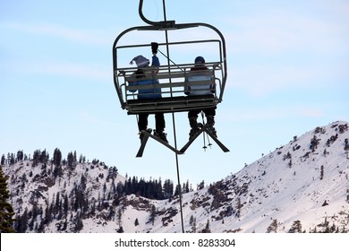 Skiers On Chairlift At Lake Tahoe Ski Resort.